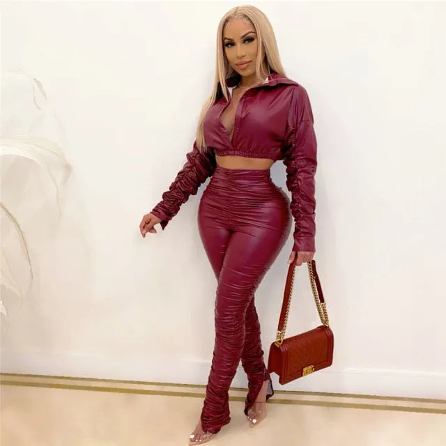 Trendy Faux Leather Two Piece Crop Top And Slit Pants Set